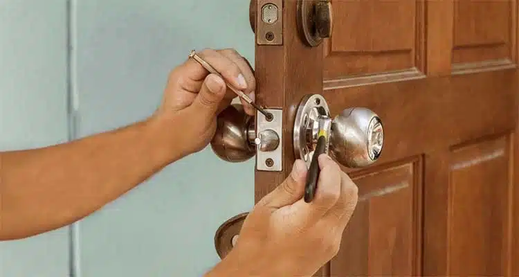 lock hardware and repair A locksmith opening a door with a key, providing lock and hardware repair solutions, lock hardware and repair, locksmith, Locks R Us Locksmith